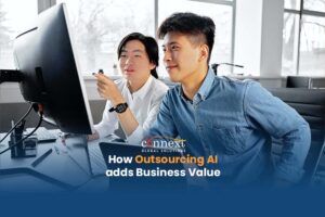 How-Outsourcing-AI-adds-Business-Value-artificial-tech-developers-inside-office-looking-at-computer-main