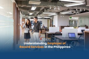 Understanding-Employer-of-Record-Services-in-the-Philippines-asian-discussing-pointing-to-window-inside-office-workstation-space-call-center