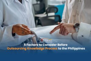 5-Factors-to-Consider-Before-Outsourcing-Knowledge-Process-to-the-Philippines-people-in-corporate-attire-holding-an-office-document-handbook