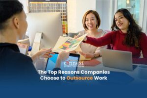 The-Top-Reasons-Companies-Choose-to-Outsource-Work-asian-indian-corporate-in-office-with-laptop