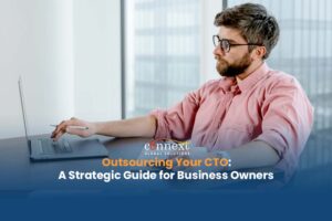 Outsourcing-Your-CTO-A-Strategic-Guide-for-Business-Owners-man-in-corporate-attire-using-laptop-in-office