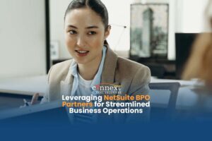 Leveraging-NetSuite-BPO-Partners-for-Streamlined-Business-Operations-woman-in-corporate-attire-working-with-computer-in-office-meeting-1@1x_1