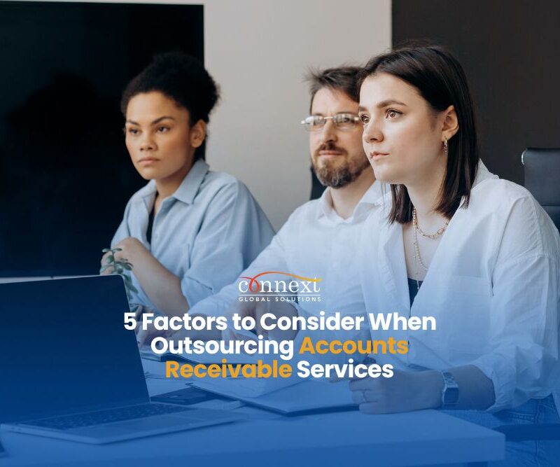 5 critical factors to consider when outsourcing Accounts Receivable services people with laptop in a meeting in an office