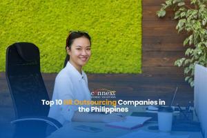 Top-10-HR-Outsourcing-Companies-in-the-Philippines-asian-woman-corporate-attire-smiling-sitting-in-office-chair-with-papers-in-office