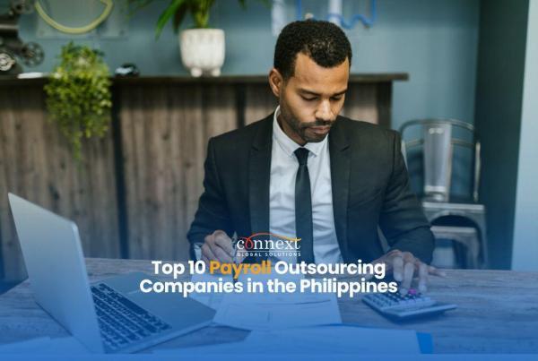 Top-10-Payroll-Outsourcing-Companies-in-the-Philippines-man-in-corporate-attire-suit-and-necktie-with-laptop-and-calculator-working-in-office