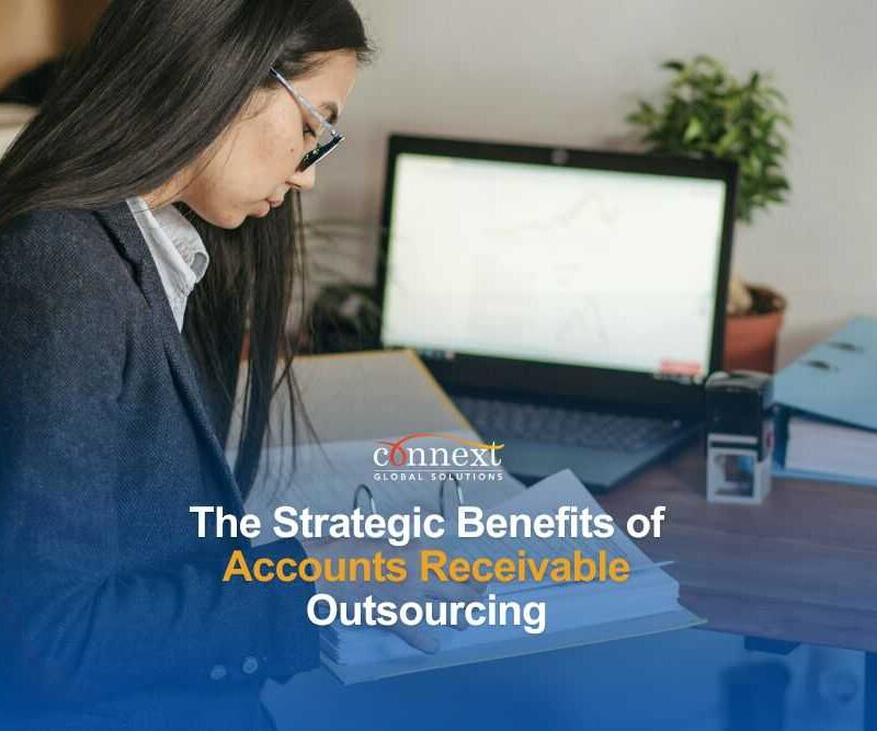 benefits-of-accounts-receivable-outsourcing-woman-in-corporate-attire-with-laptop-and-office-files