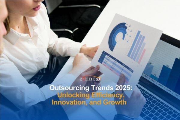 Outsourcing Trends 2025: Unlocking Efficiency, Innovation, and Growth woman with a graph and laptop in office