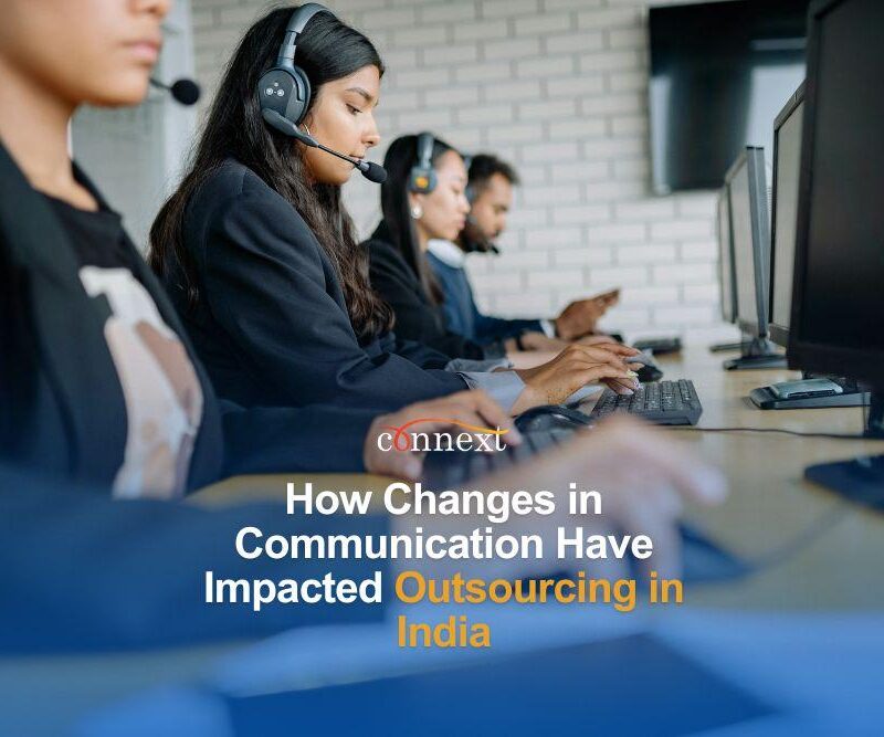 How Changes in Communication Have Impacted Outsourcing in India staff in corporate attire wearing headset in office