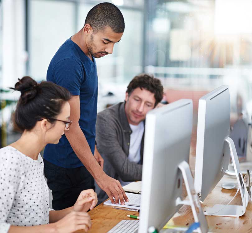 tech-team-collaborating-at-workstations