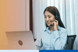 Customer service outsourcing representative wearing a headset and assisting clients online, representing trusted customer service outsourcing companies.