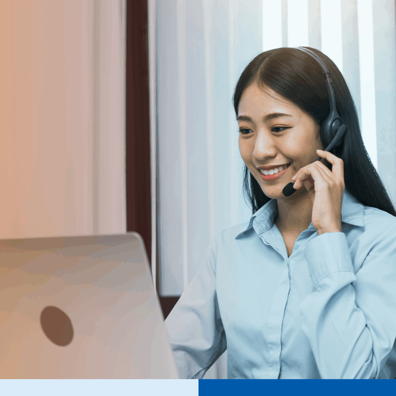 Customer service outsourcing representative wearing a headset and assisting clients online, representing trusted customer service outsourcing companies.