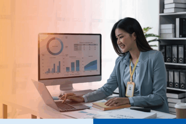 Businesswoman sits at work with laptop and computer and analyzes corporate and data activities 