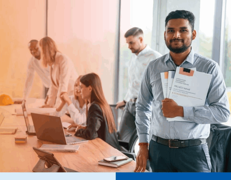 man holding project folders wearing corporate attire smiling in office in office setting meeting