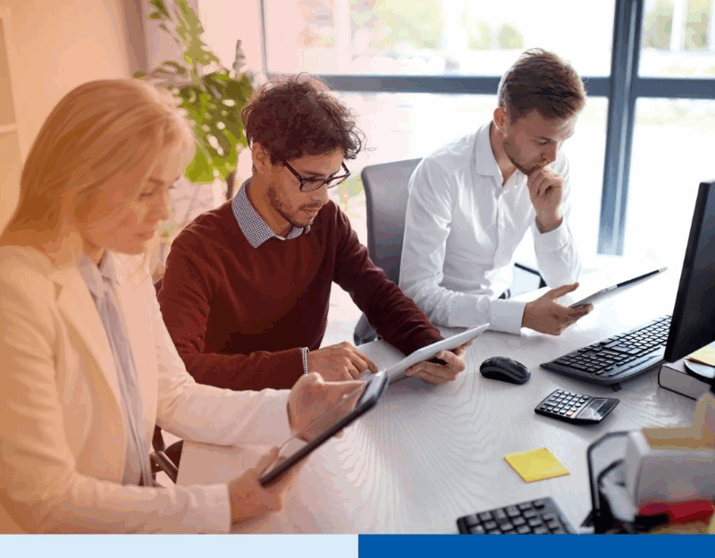 group-of-corporate-professionals-using-tablets-in-office