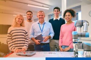 smiling people in corporate attire holding tablets in office