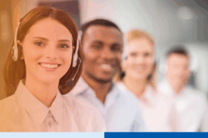 Similing woman wearing headset in a call center 