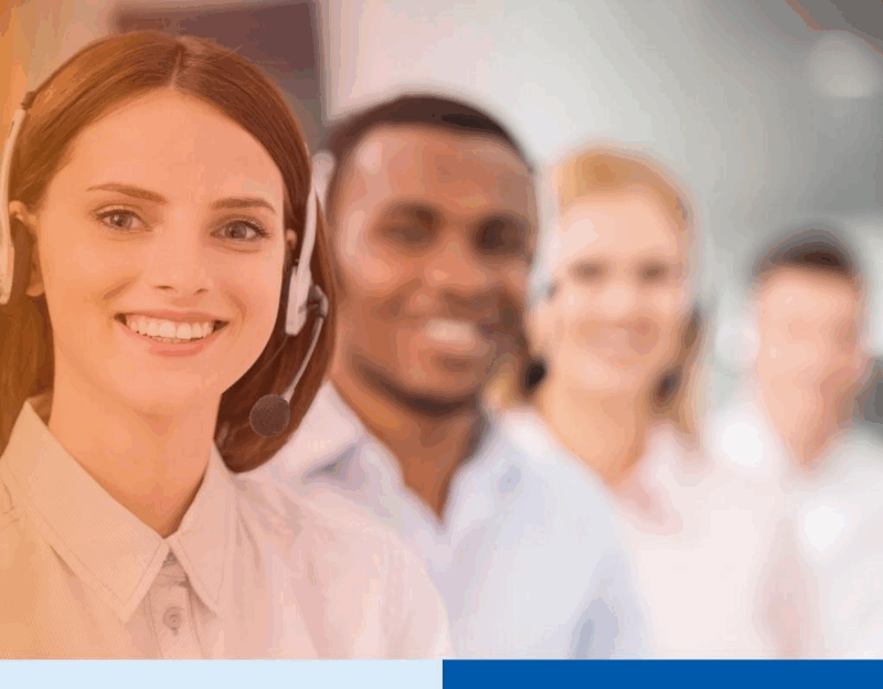 Similing woman wearing headset in a call center 