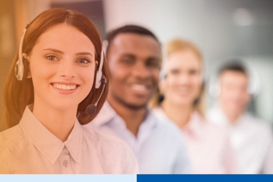 Similing woman wearing headset in a call center 