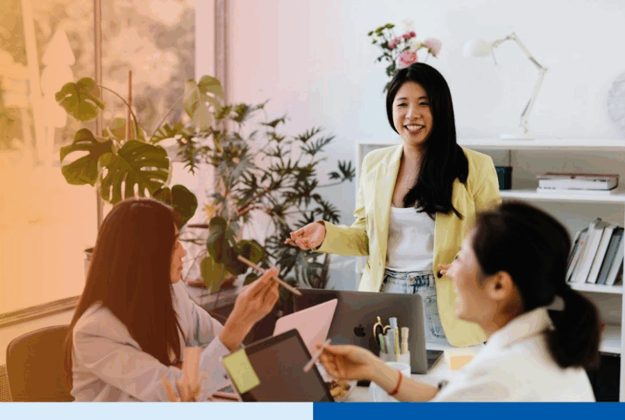 Asian Woman Talking to Her Colleagues in a MeetingÂ