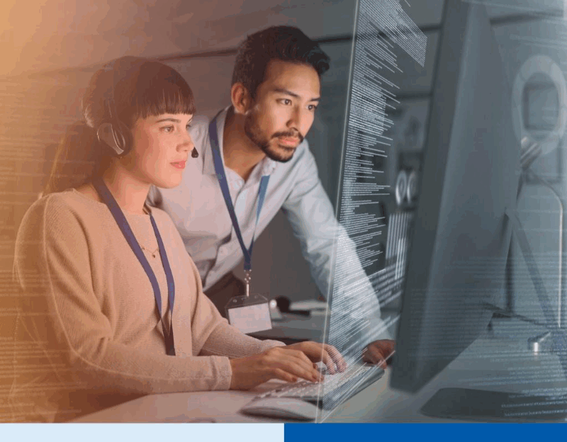 Professionals collaborating on data compliance tasks at a computer workstation, illustrating the role of an external Data Protection Officer (DPO) in ensuring PDPA compliance 