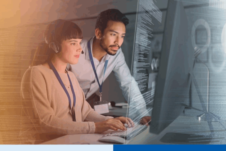 Professionals collaborating on data compliance tasks at a computer workstation, illustrating the role of an external Data Protection Officer (DPO) in ensuring PDPA complianceÂ