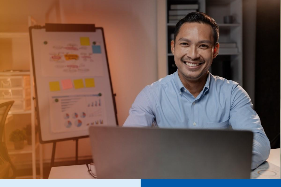 Asian businessman in startup office managing BPO vendor transition during hiring freeze in business process outsourcing