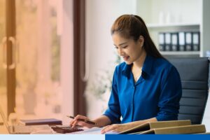 Canadian finance leaders reviewing CAD—PHP exchange rate trends while evaluating outsourcing costs with Philippine based teams.