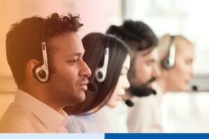 Group of call center agents making calls and working on their computers