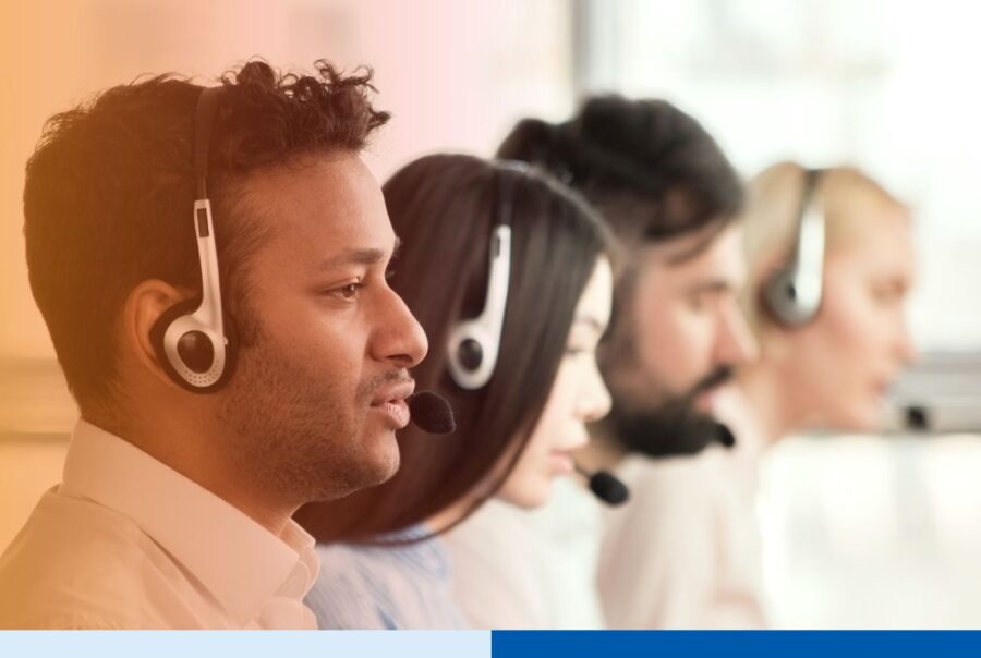 Group of call center agents making calls and working on their computers