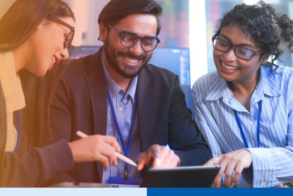 An Indian tech leader teaching a diverse team of IT professionals