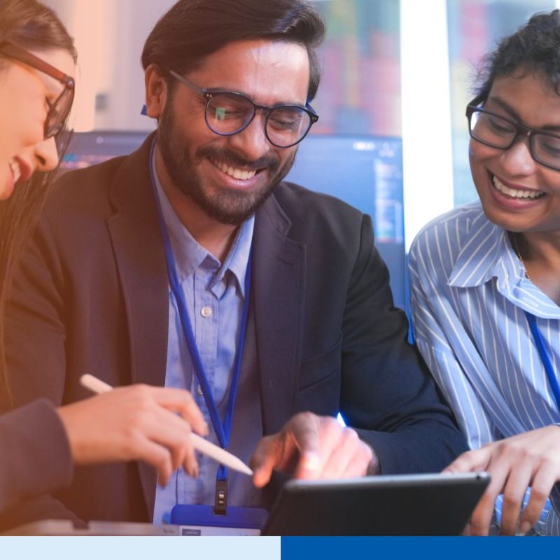 An Indian tech leader teaching a diverse team of IT professionals