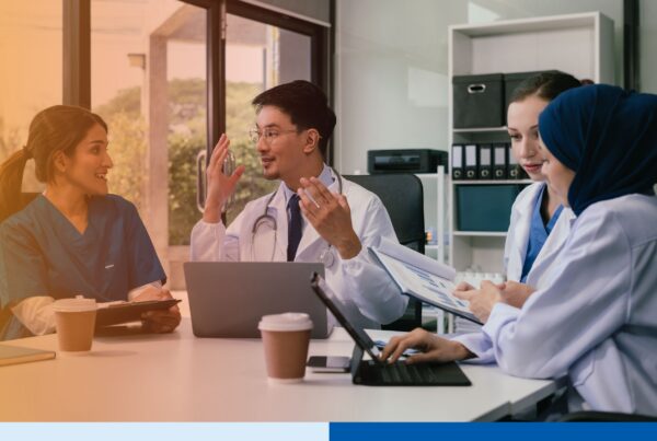 Healthcare professionals managing digital medical records in a secure offshore support environment