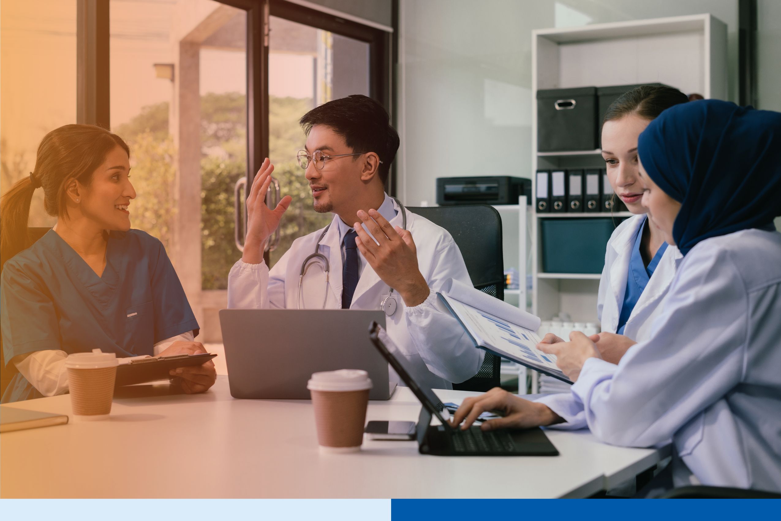 Healthcare professionals managing digital medical records in a secure offshore support environment