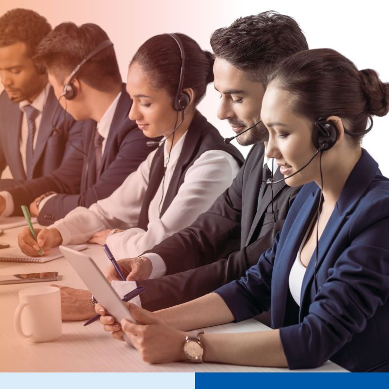 A group of dedicated Colombian offshore team working together for an outsourcing project.