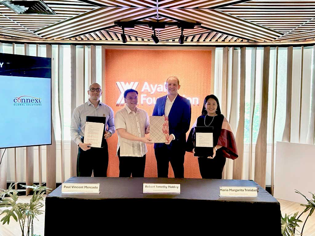 Connext and Ayala Foundation exchange signed partnership documents, April 17, 2026)