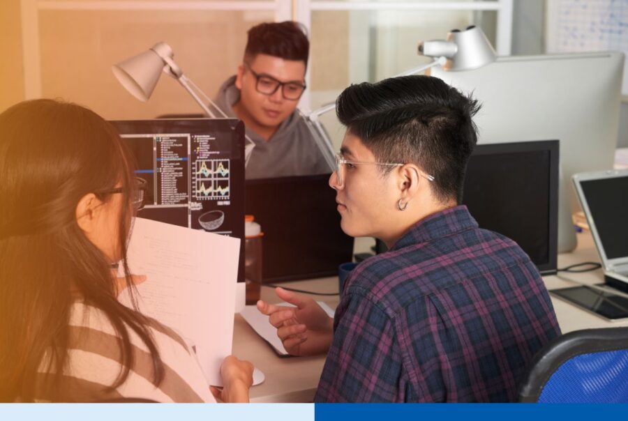 A group of software developers from Philippines working together for an outsourcing project.