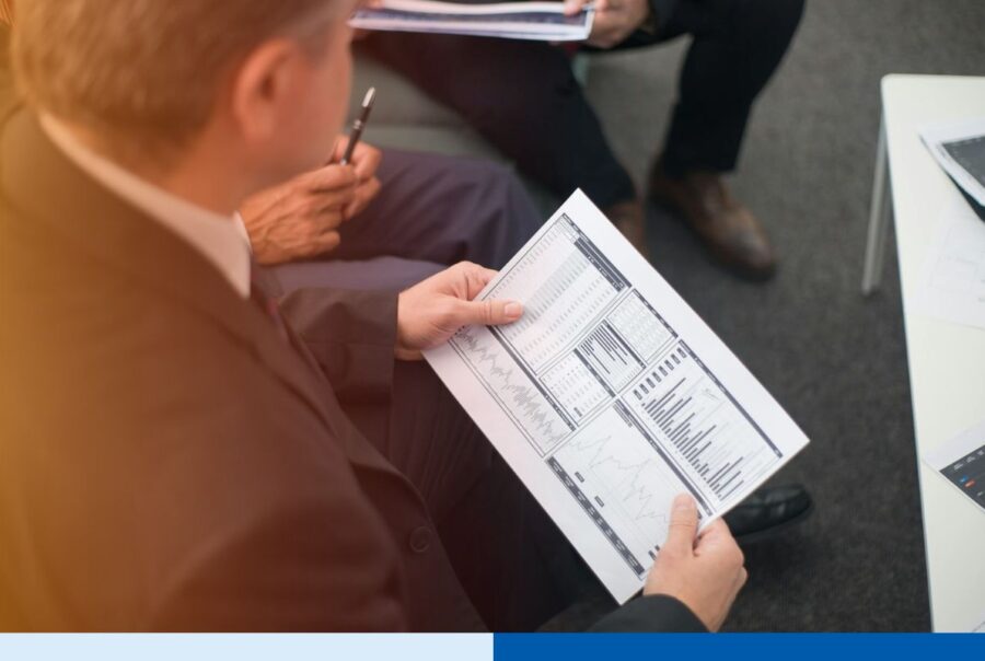 Mid-market executives reviewing outsourcing strategy options including cost, talent access, speed, and innovation focus