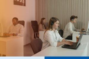 Healthcare RCM team reviewing AI-assisted revenue cycle management workflows on laptop