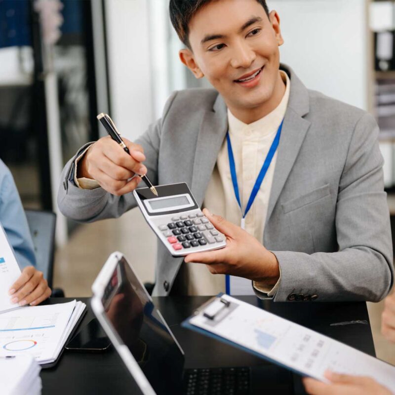 Offshore payroll specialist working alongside AI payroll software in Connext's hybrid human-AI payroll operations model