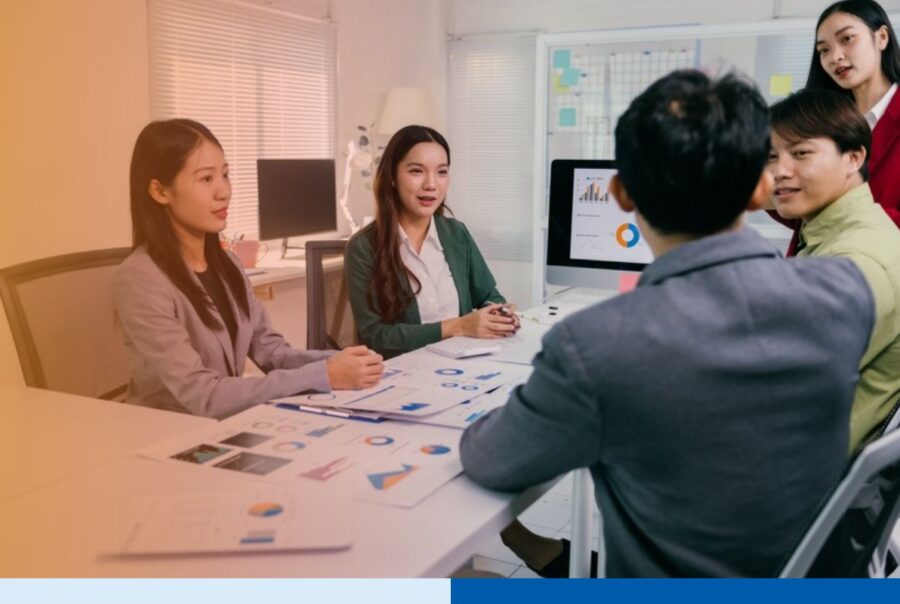 Executives in a meeting discussing how to choose an offshore staffing provider