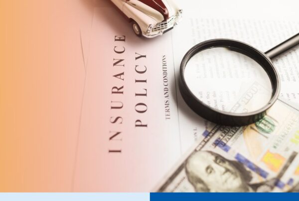 Magnifying glass reviewing an insurance claim document