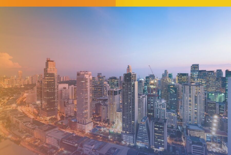 An aerial view of the Makati business district skyline at sunset, representing Connext Global Solutions premier offshore BPO operations and back-office infrastructure in the Philippines.