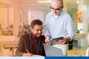 Employee shadowing an experienced mentor