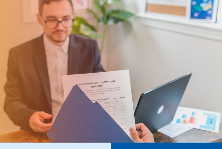 Loan processor reviewing mortgage files