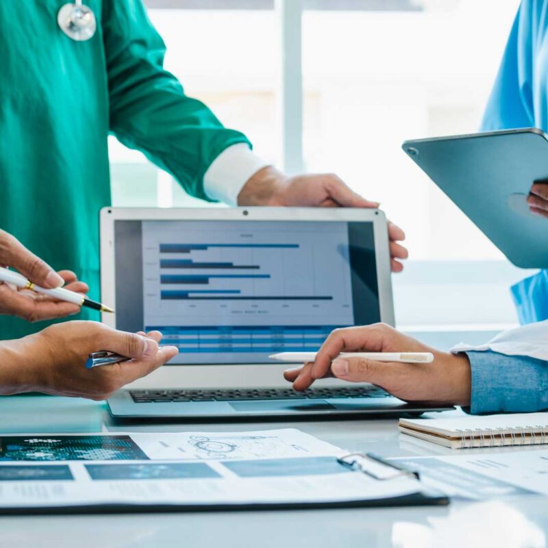 Offshore clinical data abstraction specialist reviewing patient chart data inside a client's EHR through Connext's HIPAA-compliant co-managed model
