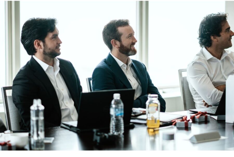 Collogues discussing the proper way to execute global BPO operations.