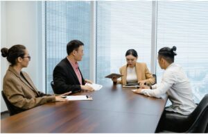 Workers discussing about offshore staffing provider 