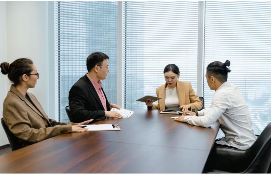 Workers discussing about offshore staffing provider