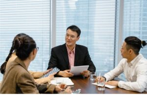 Clients talking about how to compare outsourcing pricing models 