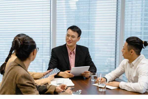 Clients talking about how to compare outsourcing pricing models 